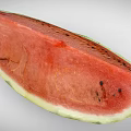 Fresh Watermelon Slice With Red Flesh Black Seeds And Green Rind