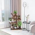 Wooden Multi Tiered Plant Stand Holding Various Green Potted Plants for Indoor Garden Decor