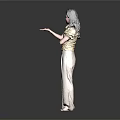 Woman in yellow top and beige pants standing with crossed arms against dark background