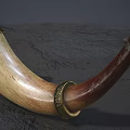 Handcrafted Wooden Horn Musical Instrument With Intricate Carved Patterns And Red White Beaded Strings