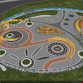 Colorful Circular Children's Playground With Spiral Structure Sandpit Pavement And Trees