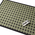 Square Rug With Black Border And Light Colored Dot Pattern Featuring Silver Tool On Top