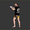 Man In Black T Shirt And Yellow Shorts With White Boxing Gloves Training Stance