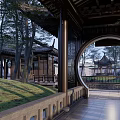 Traditional Chinese Garden Landscape With Wooden Bridge Pond Pavilion And Rock Formations