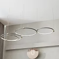 Modern Circular Chandeliers With Gold Metal Frame And LED Light In Minimalist Interior