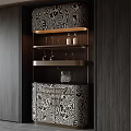 Elegant Wine Cabinet With Patterned Design And Brass Shelves Holding Wine Glasses