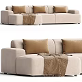 Cozy Beige Fabric Sectional Sofa With Brown Pillows And Throw Blanket