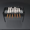 Grill With Skewers And Ice Cubes On Black Metal Frame With Wooden Handles