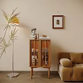 Warm Living Room Interior With Wooden Sideboard Decorative Items Floor Lamp And Green Plant