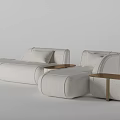 Modern White Fabric Sectional Sofa With Matching Side Tables And Decorative Pillows