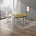 Round Glass Top Dining Table With Bar Stools On Wooden Floor And Snowy Window View