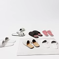 Various Colored Slippers Including White Black Pink And Patterned On Soft Carpet
