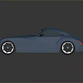 Vintage Blue Sports Car With Streamlined Body Round Headlights And Black Wheels