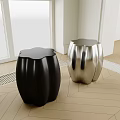 Modern Black and Silver Curved Stools in Indoor Space with Sleek Surface Design