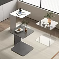 Modern Interior With White Gray And Glass Side Tables Holding Magazine Coffee Cup And Plant