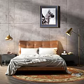 Double Bed with Brown Leather Headboard White Pillows Gray Blanket and Wall Art in Bedroom