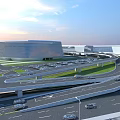 Modern Multi-level Bridge Connecting Curved Transportation Hub With Roads Parking And Green Areas