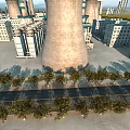 Industrial Plant With Tall Cooling Towers Surrounding Buildings And Tree Lined Road