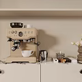 Beige Coffee Machine As Kitchen Appliance On Marble Countertop With White Cabinets And Tulip Vase