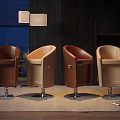 Brown And Beige Leather Bar Stools With Metal Bases In Modern Interior Design