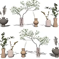 Various Neutral Toned Decorative Vases With Green Foliage And Dried Plants