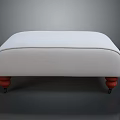 White Upholstered Ottoman With Red Legs And Round Base In Simple Design