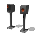 High Quality Black Speakers With Orange Drivers On Sturdy Stands For Home Audio