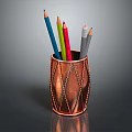 Copper Pen Holder With Colored Pencils On Dark Reflective Surface