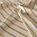 Beige Woven Fabric With Colorful Striped Patterns And Dotted Details