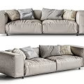Modern Beige Two Seater Sofa With Striped Grey Pillows And Soft Fabric Design