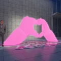 Giant Illuminated Pink Heart Shaped Hands Inflatable Structure With LOVE ACTUALLY Text On Ground