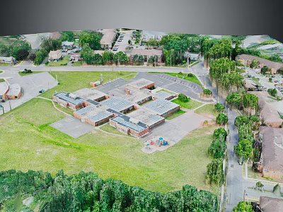 Aerial View of Building Complex with Green Spaces Trees Parking Areas Roads and Children's Playground 3d model
