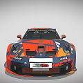 Porsche Race Car With Orange And Blue Camouflage Design And Rear Spoiler