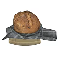 Artisanal Rustic Bread with Crusty Exterior on Checkered Cloth and Wooden Board