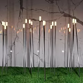 Modern Outdoor Lights With Slim Metal Poles And White Lamps On Green Grass