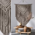 Boho Macramé Wall Hanging With Feather Design And Decorative Clay Vases On Wooden Table