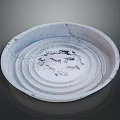 Light Gray Ceramic Plate With Cracked Surface And Intricate Central Carvings