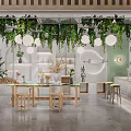 Lush Green Plant Specialty Store Interior With Hanging Vines Pendant Lights White Shelves And Wooden Tables