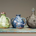 Three Decorative Ceramic Electrical Appliances With Handles In Green Blue Gray