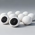 White Spherical Food Some Cut Open With Black Inner Filling On White Surface