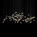 Elegant Gold and Silver Butterfly Shaped Pendant Chandelier Hanging on Black Background