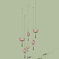 Pink Lotus Shaped Multiple Hanging Pendant Lights Against Light Blue Background