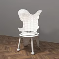 Golden Modern Accent Chair With Unique Shape On Herringbone Wooden Floor