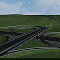 Highway Interchange Bridge with Curved Roads and Green Grassland Under Blue Sky