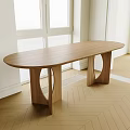 Oval Wooden Dining Table with Curved Wooden Legs in Herringbone Floor Room and Natural Light