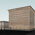 Tall Classical Office Building With Multiple Windows Adjacent Low Rise And Trees