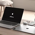 Laptop and Tablet Workspace with Headphones and Charging Case