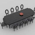 Black Oval Wooden Dining Table Set With Eight Chairs And Red Centerpiece