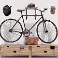 Vintage Bicycle With Leather Seat Hats And Leather Bag On Wooden Cabinet Drawers