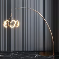 Modern Golden Arc Floor Lamp With Illuminated Ring Shades Against Dark Striped Wall